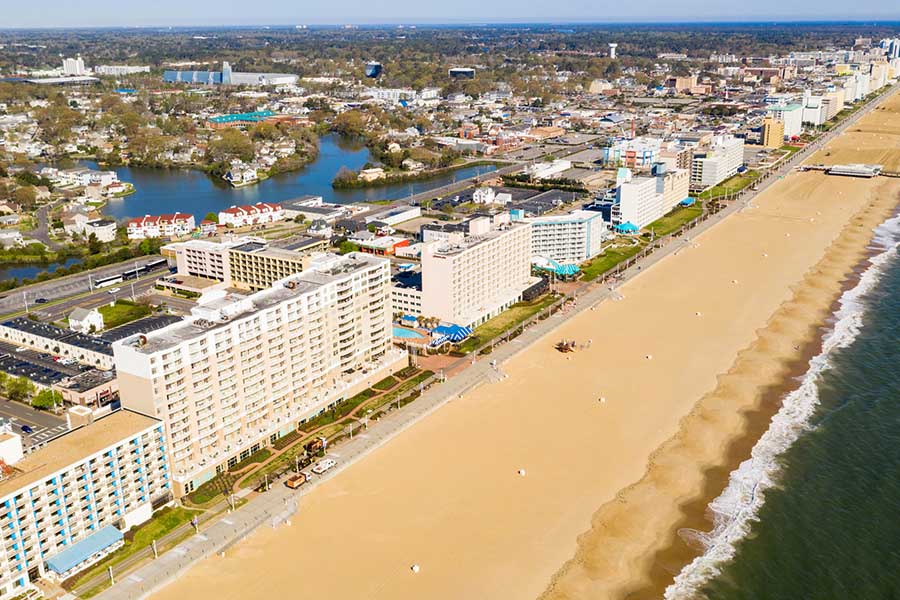 An aerial view of Ocean City, Maryland complete with both waterfront properties and businesses further inland. - staplesagency.com