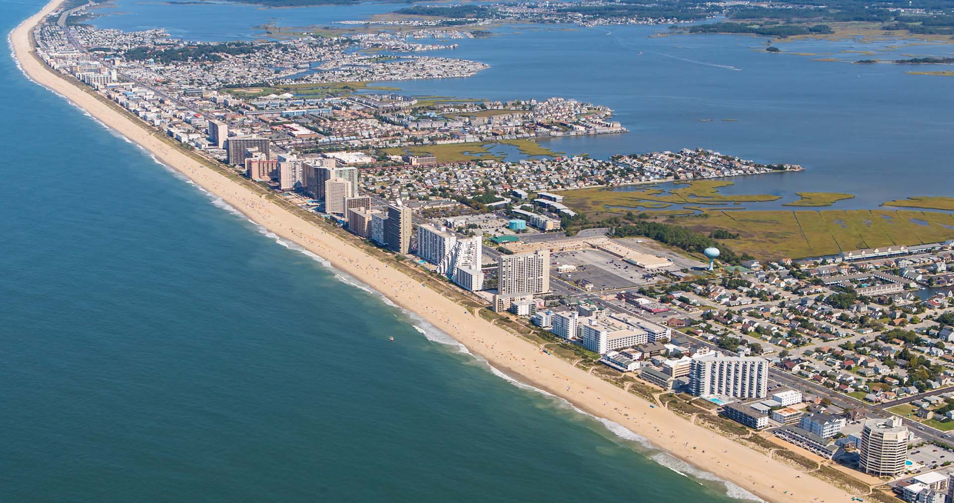Aerial view of beachy peninsula town.